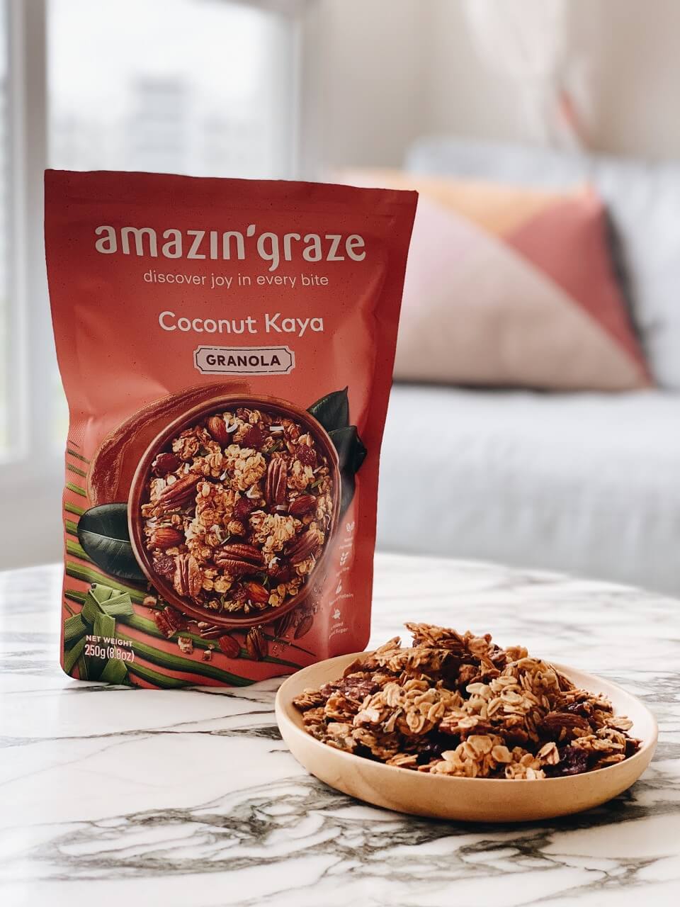 Amazin' Graze granola displayed on a marble table
